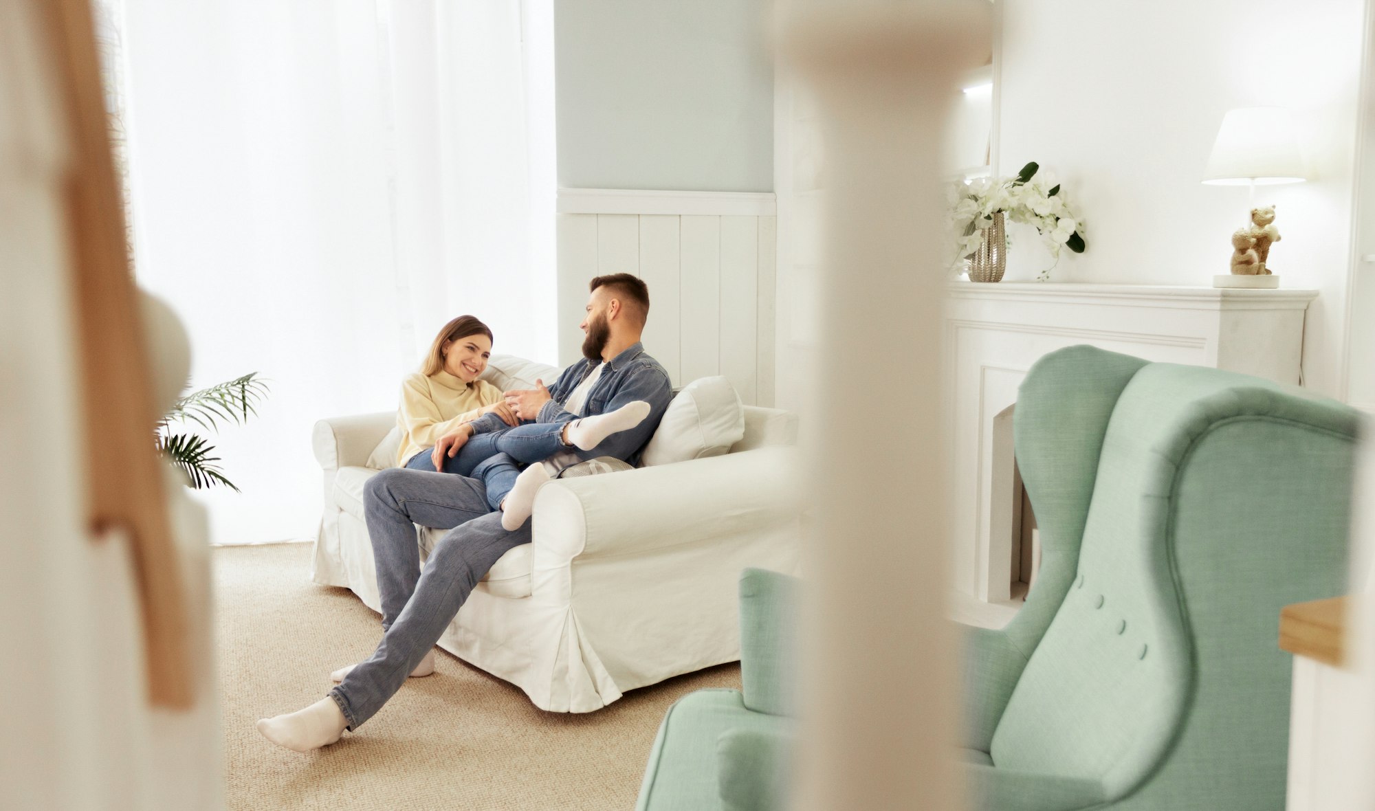 Loving Couple Relaxing On Sofa In Living Room